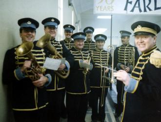 "Poirot" filming for ITV 1998 (JP front L with tenor horn). We were " Farley's Pork Pies" works-band filming near Teddington at the Hampton Road Waterworks Primary Filter Plant (play the horn and see the world!) with composer Chris Gunning ( front right).