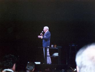 Frank Sinatra Munich 1990 (pic taken from JP orchestra-seat).  Sensational European tour played to packed houses like this 12,000-seater sports-hall in Munich. Orchestra of  London and American players was conducted by Frank Sinatra Jnr.