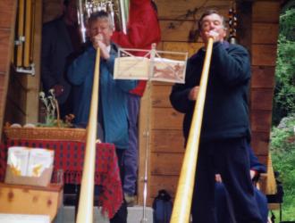 Swiss post-concert party at the Jones' chalet included alp-horn trios played by (L-R) Frank Lloyd, James Gourlay (tuba), JP as Philip's ashes were scattered in the surrounding meadow.